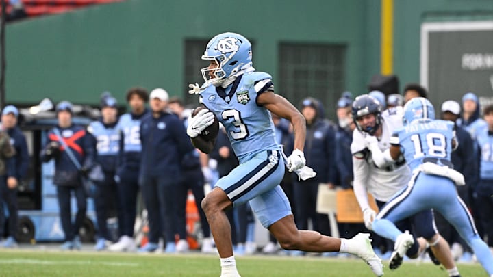 Dec 28, 2024; Boston, MA, USA; North Carolina Tar Heels wide receiver Chris Culliver (3) returns a kick for a touchdown against the Connecticut Huskies during the first half at Fenway Park. 
