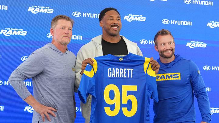 Jun 2, 2026; Woodland Hills, CA, USA; Los Angeles Rams defensive end Myles Garrett (95) poses with general manager Les Snead (left) and coach Sean McVay at press conference at Rams Practice Facility. Mandatory Credit: Kirby Lee-Imagn Images