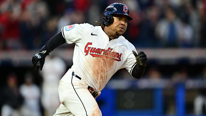 Oct 17, 2024; Cleveland, Ohio, USA; Cleveland Guardians third baseman Jose Ramirez (11) hits a double during the fifth inning against the New York Yankees in game 3 of the American League Championship Series at Progressive Field. Mandatory Credit: David Dermer-Imagn Images