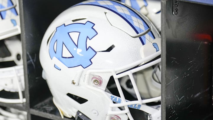 Dec 27, 2023; Charlotte, NC, USA; North Carolina Tar Heels white helmet during pregame warm ups against the West Virginia Mountaineers at Bank of America Stadium. Mandatory Credit: Jim Dedmon-Imagn Images