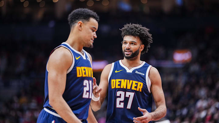 Dec 31, 2025; Toronto, Ontario, CAN; Denver Nuggets guard Jamal Murray (27) stands beside forward Spencer Jones (21) during a break in play against the Toronto Raptors during the second half at Scotiabank Arena. Mandatory Credit: Kevin Sousa-Imagn Images