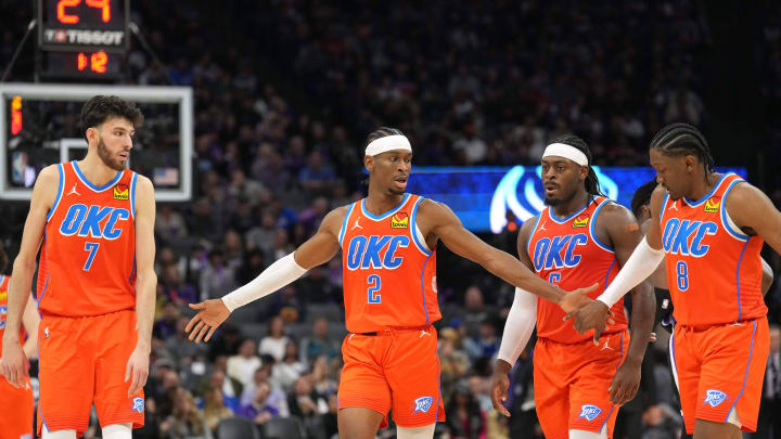 Dec 14, 2023; Sacramento, California, USA; Oklahoma City Thunder guard Shai Gilgeous-Alexander (2) walks to the bench with forwards Chet Holmgren (7) and Jalen Williams (8) and guard Luguentz Dort (second from right) during the fourth quarter against the Sacramento Kings at Golden 1 Center. Mandatory Credit: Darren Yamashita-USA TODAY Sports Dec 14, 2023; Sacramento, California, USA; Oklahoma City Thunder guard Shai Gilgeous-Alexander (2) walks to the bench with forwards Chet Holmgren (7) and Jalen Williams (8) and guard Luguentz Dort (second from right) during the fourth quarter against the Sacramento Kings at Golden 1 Center. Mandatory Credit: Darren Yamashita-USA TODAY Sports