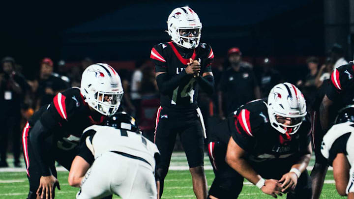 Chaminade-Madonna freshman quarterback Malik Leonard completed 26 of 30 passes for 435 yards and five touchdowns and rushed two times for 13 yards to power the Lions past Western, 56-0. Chaminade-Madonna freshman quarterback Malik Leonard completed 26 of 30 passes for 435 yards and five touchdowns and rushed two times for 13 yards to power the Lions past Western, 56-0.