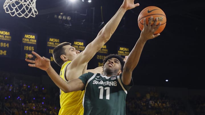 Feb 21, 2025; Ann Arbor, Michigan, USA; Michigan State Spartans guard Jase Richardson (11) goes to the basket during the second half at Crisler Center. Mandatory Credit: Brian Bradshaw Sevald-Imagn Images