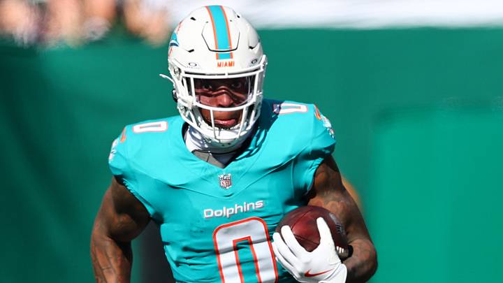 Miami Dolphins running back Ollie Gordon II (0) runs the ball against the New York Jets during the first quarter at MetLife Stadium.  Mandatory Credit: Vincent Carchietta-Imagn Images