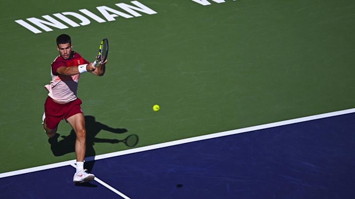 Mar 8, 2025; Indian Wells, CA, USA; Carlos Alcaraz (ESP) hits a ball against Quentin Halys (FRA) at Indian Well Tennis Garden.