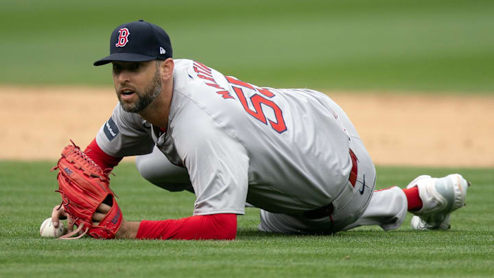 Apr 3, 2024; Oakland, California, USA; Boston Red Sox pitcher Chris Martin (55) looks up from the turf after trying to make a play on an infield single by Oakland Athletics third baseman J.D. Davis during the eighth inning at Oakland-Alameda County Coliseum. Mandatory Credit: D. Ross Cameron-USA TODAY Sports