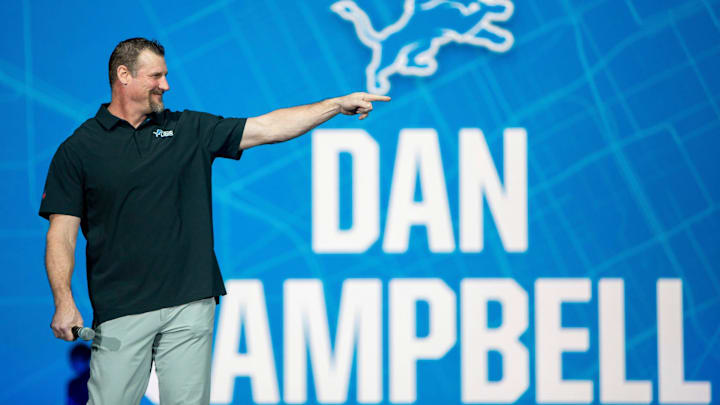 Head Coach Dan Campbell stands on stage during the Detroit Lions new uniform reveal event in 2025 at Ford Field