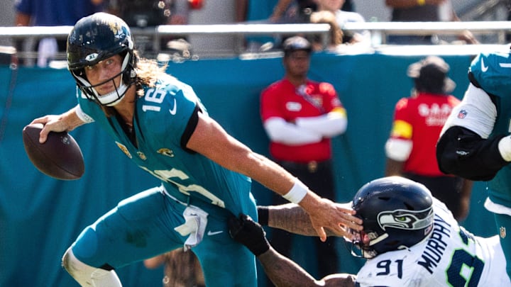 Jacksonville Jaguars quarterback Trevor Lawrence (16) sheds off Jacksonville Jaguars defensive tackle Arik Armstead (91) during the third quarter in an NFL football game at EverBank Stadium, Sunday, Oct. 12, 2025, in Jacksonville, Fla. Jacksonville Jaguars quarterback Trevor Lawrence (16) sheds off Jacksonville Jaguars defensive tackle Arik Armstead (91) during the third quarter in an NFL football game at EverBank Stadium, Sunday, Oct. 12, 2025, in Jacksonville, Fla.