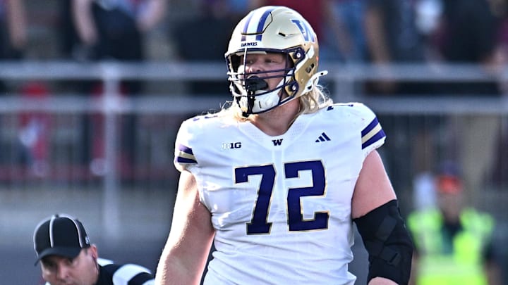 John Mills (72) walks through the Apple Cup, casting a huge shadow. John Mills (72) walks through the Apple Cup, casting a huge shadow.