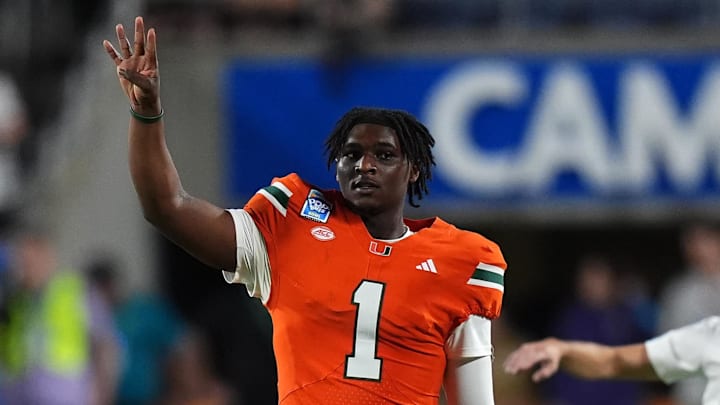Dec 28, 2024; Orlando, FL, USA; Miami Hurricanes quarterback Cam Ward (1) gestures during the second half against the Iowa State Cyclones  at Camping World Stadium. Mandatory Credit: Jasen Vinlove-Imagn Images