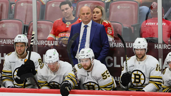 May 6, 2024; Sunrise, Florida, USA; Boston Bruins head coach Jim Montgomery watches from the bench against the Florida Panthers during the third period in game one of the second round of the 2024 Stanley Cup Playoffs at Amerant Bank Arena. Mandatory Credit: Sam Navarro-Imagn Images