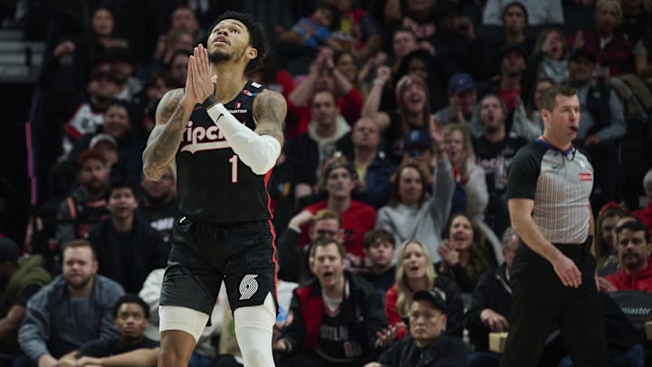 Jan 11, 2025; Portland, Oregon, USA; Portland Trail Blazers guard Anfernee Simons (1) reacts after being fouled and scoring a basket during the second half against the Miami Heat at Moda Center. Mandatory Credit: Troy Wayrynen-Imagn Images
