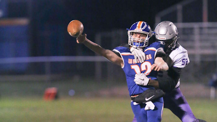 Joppatowne's Zion Elee wraps up Boonsboro QB Colin Telemeco as he releases the ball.