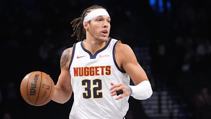Oct 29, 2024; Brooklyn, New York, USA; Denver Nuggets power forward Aaron Gordon (32) dribbles the ball up the court against the Brooklyn Nets during the first half of the game at Barclays Center.