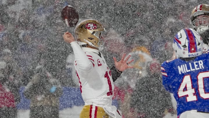 Dec 1, 2024; Orchard Park, New York, USA; San Francisco 49ers quarterback Brock Purdy (13) fumbles the ball attempting to throw against the Buffalo Bills during the second half at Highmark Stadium. Mandatory Credit: Gregory Fisher-Imagn Images