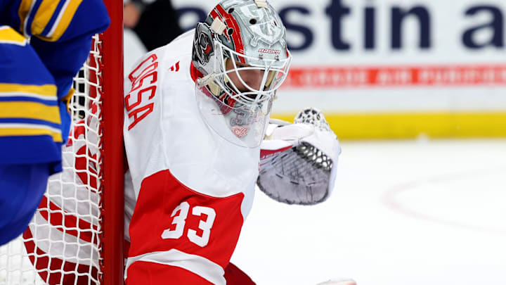 Dec 9, 2024; Buffalo, New York, USA;  Detroit Red Wings goaltender Sebastian Cossa (33) looks for the puck during the second period against the Buffalo Sabres at KeyBank Center. Mandatory Credit: Timothy T. Ludwig-Imagn Images