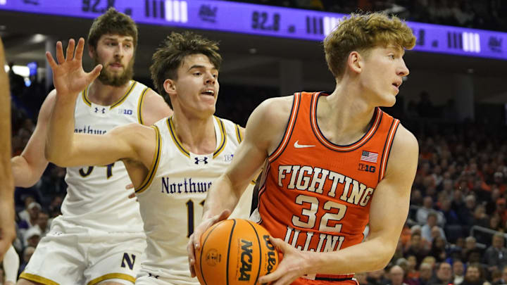 Dec 6, 2024; Evanston, Illinois, USA; Northwestern Wildcats guard Brooks Barnhizer (13) defends Illinois Fighting Illini guard Kasparas Jakucionis (32) during the first half at Welsh-Ryan Arena. Mandatory Credit: David Banks-Imagn Images Dec 6, 2024; Evanston, Illinois, USA; Northwestern Wildcats guard Brooks Barnhizer (13) defends Illinois Fighting Illini guard Kasparas Jakucionis (32) during the first half at Welsh-Ryan Arena. Mandatory Credit: David Banks-Imagn Images