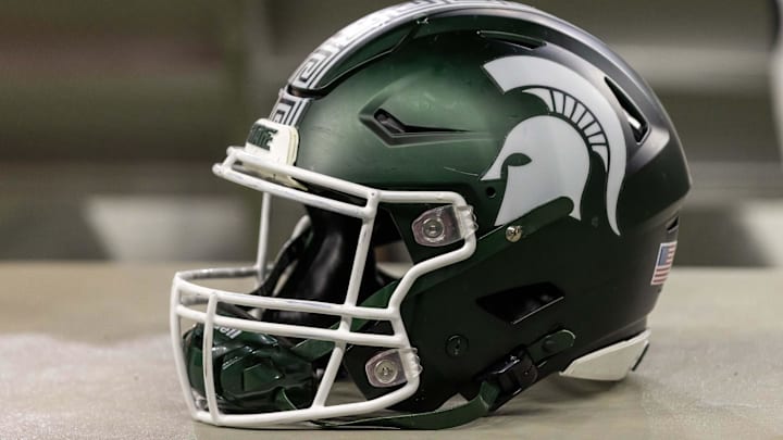 Nov 24, 2023; Detroit, Michigan, USA; A Michigan State Spartans helmet sits on a bench during the second half game against the Penn State Nittany Lions at Ford Field. Mandatory Credit: David Reginek-USA TODAY Sports