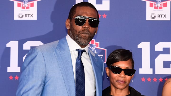 Jun 12, 2024; Foxborough, MA, USA; Former NFL player Randy Moss poses with his wife Lydia Griffith for a photo at the New England Patriots Hall of Fame induction ceremony for Tom Brady at Gillette Stadium. Mandatory Credit: Eric Canha-Imagn Images Jun 12, 2024; Foxborough, MA, USA; Former NFL player Randy Moss poses with his wife Lydia Griffith for a photo at the New England Patriots Hall of Fame induction ceremony for Tom Brady at Gillette Stadium. Mandatory Credit: Eric Canha-Imagn Images