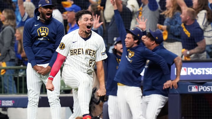 Milwaukee Brewers shortstop Willy Adames (27) reacts to Milwaukee Brewers right fielder Sal Frelick’s (10) homer (1) on a fly ball to right field during the seventh inning of Game 3 of National League wild-card series against the New York Mets on Thursday October 3, 2024 at American Family Field in Milwaukee, Wis.