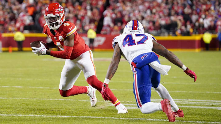 Dec 10, 2023; Kansas City, Missouri, USA; Kansas City Chiefs wide receiver Rashee Rice (4) catches a pass as Buffalo Bills cornerback Christian Benford (47) defends during the second half at GEHA Field at Arrowhead Stadium. Mandatory Credit: Denny Medley-Imagn Images