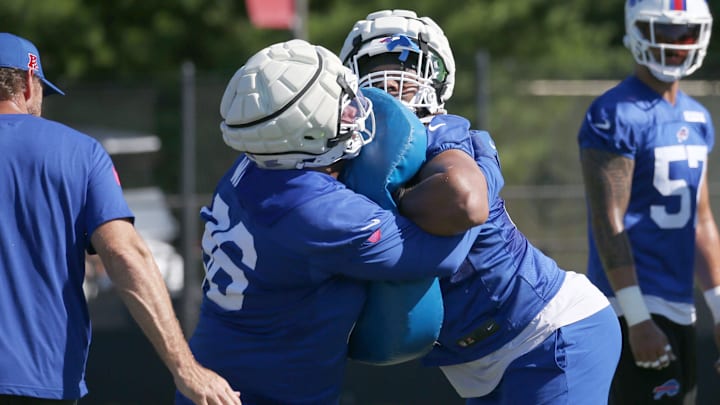 Buffalo Bills rookie defensive tackles T.J. Sanders, right, and Deone Walker lock up during drills on the opening day of Buffalo Bills training camp on Wednesday, July 23.