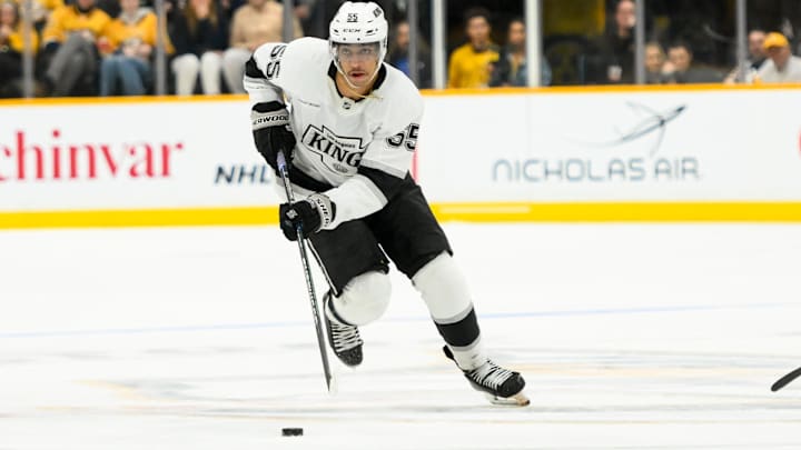 Nov 4, 2024; Nashville, Tennessee, USA;  Los Angeles Kings right wing Quinton Byfield (55) skates with the puck against the Nashville Predators during the second period at Bridgestone Arena. Mandatory Credit: Steve Roberts-Imagn Images