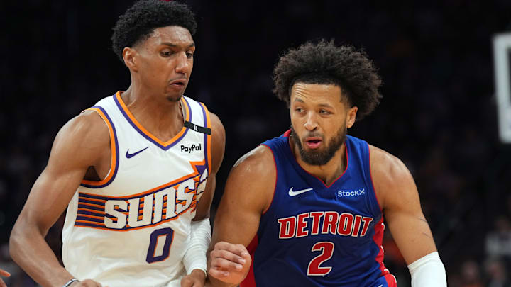 Oct 11, 2024; Phoenix, Arizona, USA; Detroit Pistons guard Cade Cunningham (2) dribbles against Phoenix Suns forward Ryan Dunn (0) during the second half at Footprint Center. Mandatory Credit: Joe Camporeale-Imagn Images