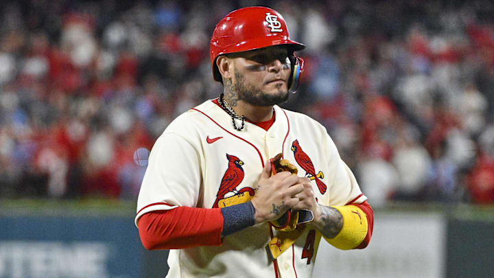 Oct 8, 2022; St. Louis, Missouri, USA; St. Louis Cardinals catcher Yadier Molina (4) walks off the field after hitting a single for his final postseason at bat in the ninth inning against the Philadelphia Phillies during game two of the Wild Card series for the 2022 MLB Playoffs at Busch Stadium. Mandatory Credit: Jeff Curry-Imagn Images
