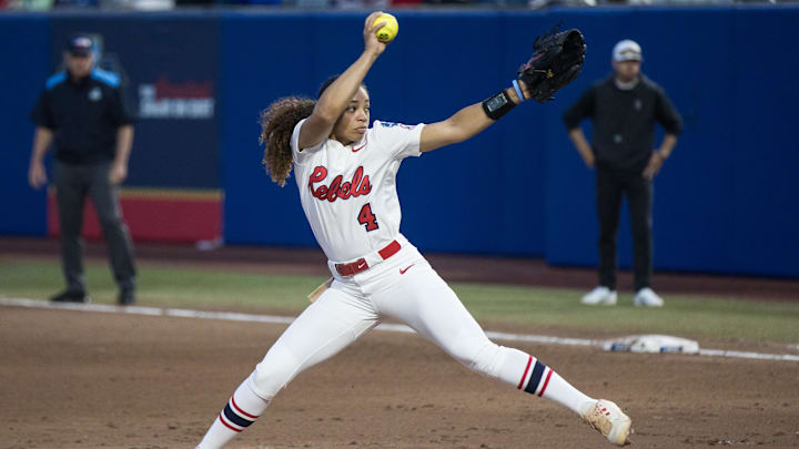 May 29, 2025; Oklahoma City, OK, USA;  Ole Miss Rebels infielder Aliyah Binford (4) throws a pitch in the fifth inning against the Texas Tech Red Raiders during the NCAA Softball Women's College World Series at Devon Park. Mandatory Credit: Brett Rojo-Imagn Images