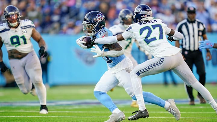 Tennessee Titans running back Tony Pollard (20) runs the ball during the fourth quarter against the Seattle Seahawks at Nissan Stadium in Nashville, Tenn., Sunday, Nov. 23, 2025.
