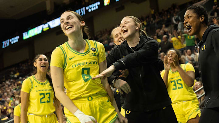 Oregon’s Elisa Mevius, center, celebrates a layup and foul against Washington with teammates during the second half at Matthew Knight Arena. Oregon’s Elisa Mevius, center, celebrates a layup and foul against Washington with teammates during the second half at Matthew Knight Arena.