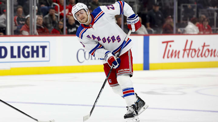 Oct 17, 2024; Detroit, Michigan, USA;  New York Rangers defenseman Adam Fox (23) skates with the puck in the third period against the Detroit Red Wings at Little Caesars Arena. Mandatory Credit: Rick Osentoski-Imagn Images
