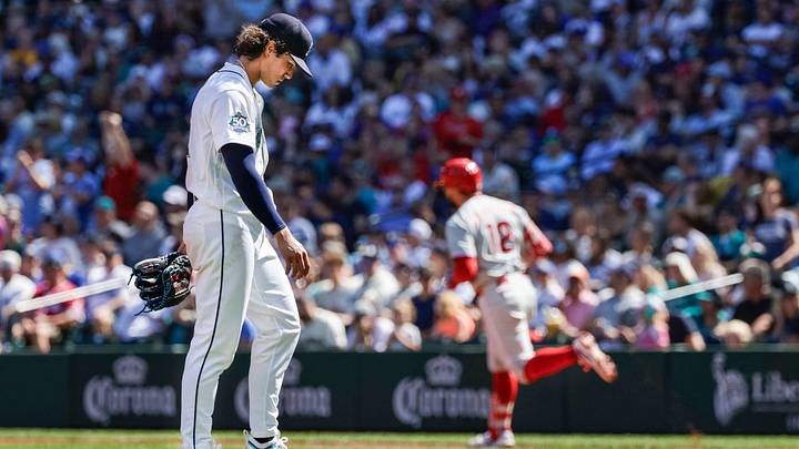 Aug 26, 2026; Seattle, Washington, USA; Seattle Mariners starting pitcher Bryan Woo (22) reacts after surrendering a three-run home run to Philadelphia Phillies designated hitter Kyle Schwarber (12, background) during the second inning at T-Mobile Park. Mandatory Credit: Joe Nicholson-Imagn Images Aug 26, 2026; Seattle, Washington, USA; Seattle Mariners starting pitcher Bryan Woo (22) reacts after surrendering a three-run home run to Philadelphia Phillies designated hitter Kyle Schwarber (12, background) during the second inning at T-Mobile Park. Mandatory Credit: Joe Nicholson-Imagn Images