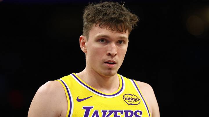 Dec 23, 2025; Phoenix, Arizona, USA; Los Angeles Lakers forward Dalton Knecht (4) against the Phoenix Suns at Mortgage Matchup Center. Mandatory Credit: Mark J. Rebilas-Imagn Images