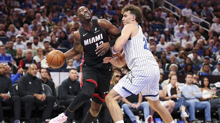 Oct 22, 2025; Orlando, Florida, USA; Miami Heat center Bam Adebayo (13) is guarded by Orlando Magic forward Franz Wagner (22) in the second quarter at Kia Center. Mandatory Credit: Nathan Ray Seebeck-Imagn Images
