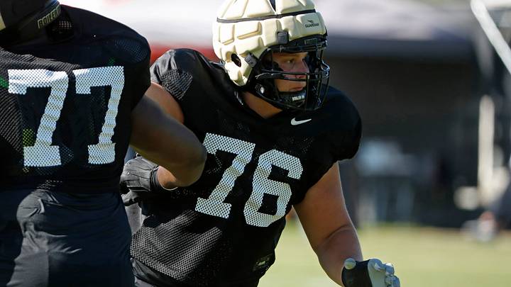 Purdue Boilermakers offensive lineman Ethan Trent runs a drill. Purdue Boilermakers offensive lineman Ethan Trent runs a drill.