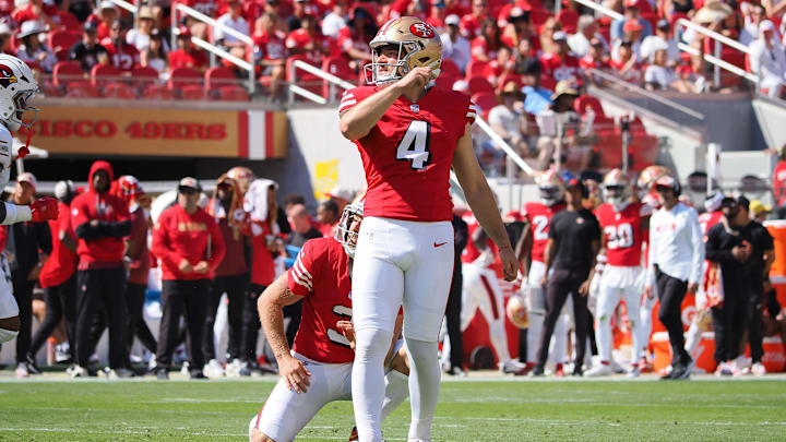 Oct 6, 2024; Santa Clara, California, USA; San Francisco 49ers kicker Jake Moody (4) follows the ball on a field goal against the Arizona Cardinals during the first quarter at Levi's Stadium.