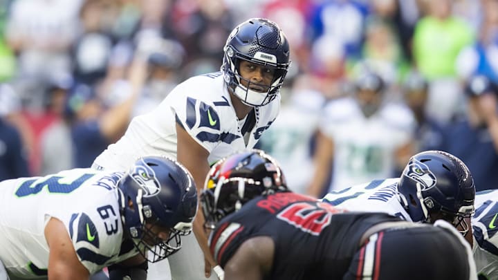 Dec 8, 2024; Glendale, Arizona, USA; Seattle Seahawks quarterback Geno Smith (7) against the Arizona Cardinals at State Farm Stadium. Mandatory Credit: Mark J. Rebilas-Imagn Images