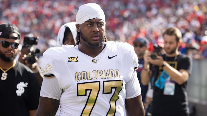 Oct 19, 2024; Tucson, Arizona, USA; Colorado Buffalos offensive tackle Jordan Seaton (77) against the Arizona Wildcats at Arizona Stadium. Mandatory Credit: Mark J. Rebilas-Imagn Images