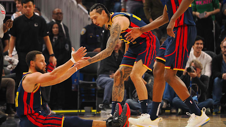 Jan 5, 2025; San Francisco, California, USA; Golden State Warriors guard Stephen Curry (30) is helped up by forward Lindy Waters III (43) after being fouled during the second quarter against the Sacramento Kings at Chase Center. Mandatory Credit: Kelley L Cox-Imagn Images Jan 5, 2025; San Francisco, California, USA; Golden State Warriors guard Stephen Curry (30) is helped up by forward Lindy Waters III (43) after being fouled during the second quarter against the Sacramento Kings at Chase Center. Mandatory Credit: Kelley L Cox-Imagn Images