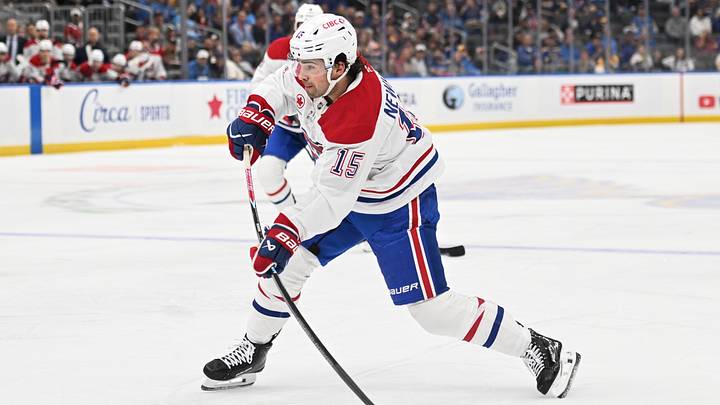 Montreal Canadiens center Alex Newhook (15) takes a shot against the St. Louis Blues in the first period at Enterprise Center.  Mandatory Credit: Joe Puetz-Imagn Images
