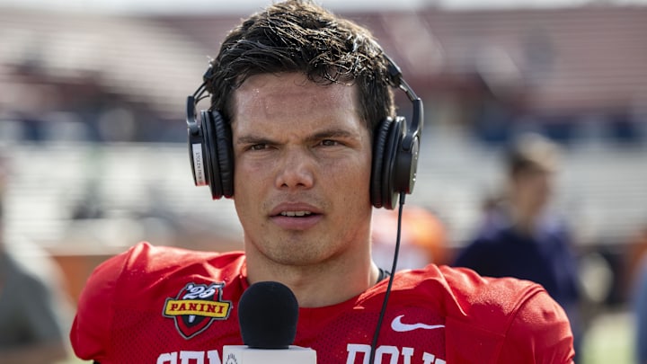 Jan 29, 2025; Mobile, AL, USA; National team quarterback Dillon Gabriel of Oregon (8) talks with media members after Senior Bowl practice at Hancock Whitney Stadium. Mandatory Credit: Vasha Hunt-Imagn Images