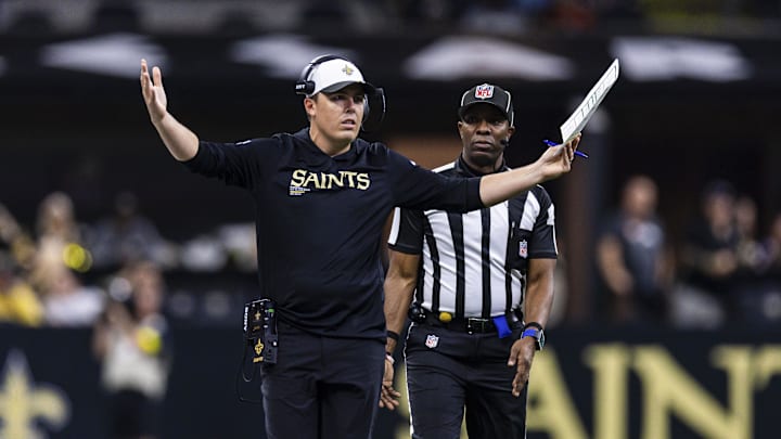 Aug 23, 2025; New Orleans, Louisiana, USA; New Orleans Saints head coach Kellen Moore questions a play call against the Denver Broncos during the first half at Caesars Superdome. Mandatory Credit: Stephen Lew-Imagn Images