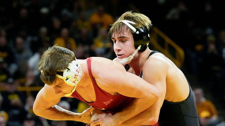 Iowa’s Drake Ayala wrestles Iowa State’s Evan Frost in a 133-pound match during the Cy-Hawk wrestling dual Saturday, Nov. 23, 2024 at Carver-Hawkeye Arena in Iowa City, Iowa.