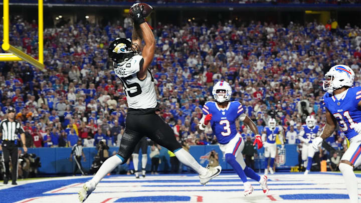 Sep 23, 2024; Orchard Park, New York, USA; Jacksonville Jaguars tight end Brenton Strange (85) makes a catch for a touchdown against Buffalo Bills safety Damar Hamlin (3) during the second half at Highmark Stadium. Mandatory Credit: Gregory Fisher-Imagn Images