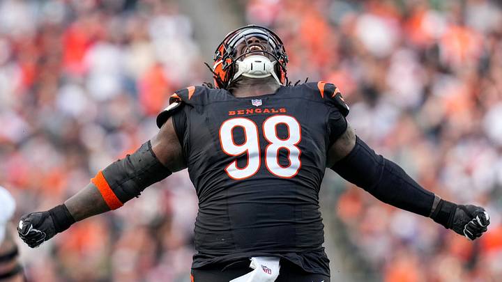Dec 28, 2025; Cincinnati, Ohio, USA; Cincinnati Bengals defensive tackle T.J. Slaton Jr. (98) celebrates after sacking Arizona Cardinals quarterback Jacoby Brissett (7) in the third quarter at Paycor Stadium. Mandatory Credit: Sam Greene-USA TODAY Network via Imagn Images Dec 28, 2025; Cincinnati, Ohio, USA; Cincinnati Bengals defensive tackle T.J. Slaton Jr. (98) celebrates after sacking Arizona Cardinals quarterback Jacoby Brissett (7) in the third quarter at Paycor Stadium. Mandatory Credit: Sam Greene-USA TODAY Network via Imagn Images