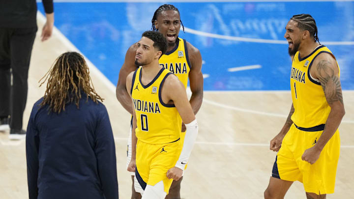 Jun 5, 2025; Oklahoma City, Oklahoma, USA; Indiana Pacers guard Tyrese Haliburton (0), forward Aaron Nesmith (center) and forward Obi Toppin (1) react after a play against the Oklahoma City Thunder in game one of the 2025 NBA Finals at Paycom Center. Mandatory Credit: Kyle Terada-Imagn Images