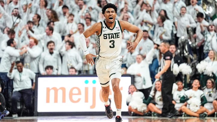 Michigan State guard Jaden Akins (3) celebrates a three point basket against Michigan during the first half at Breslin Center in East Lansing on Sunday, March 9, 2025.